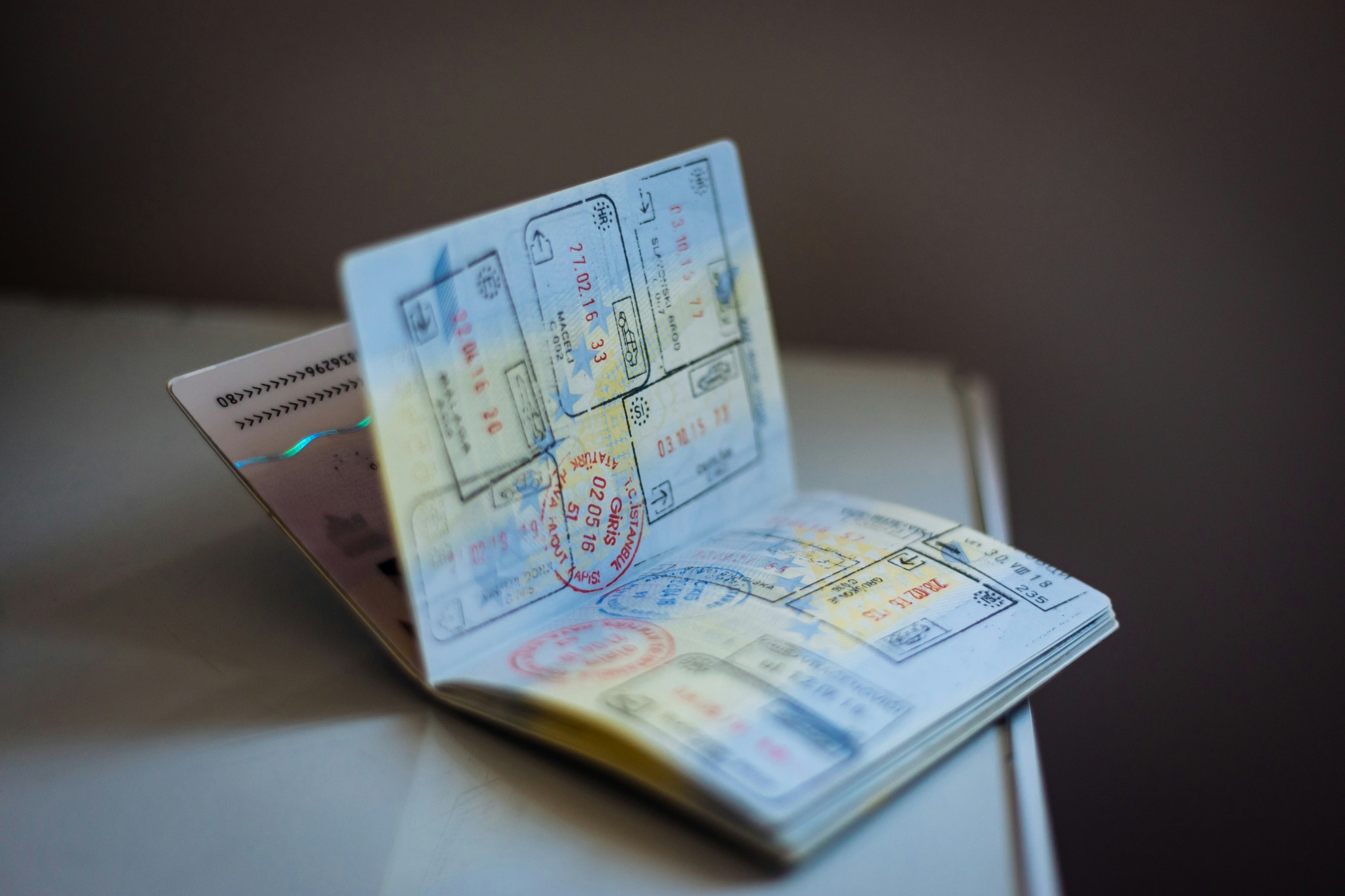 Open passport showing travel stamps